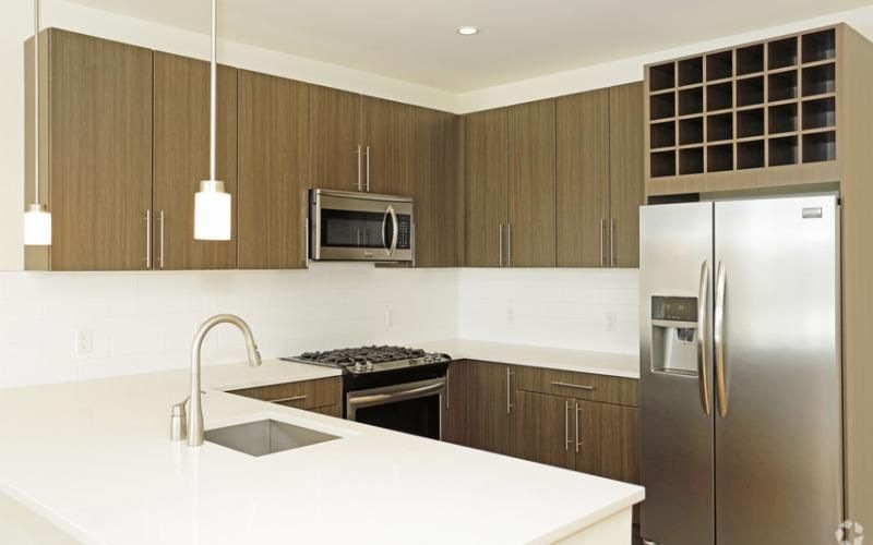 a kitchen with wooden cabinets