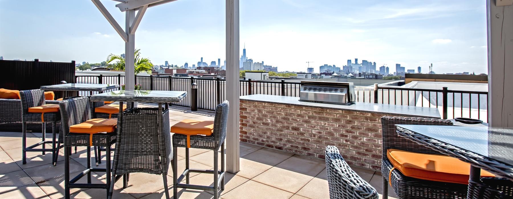 a patio with tables and chairs